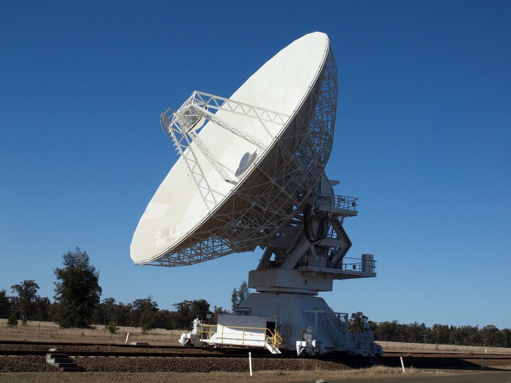 Large satellite dish pointing to the sky.