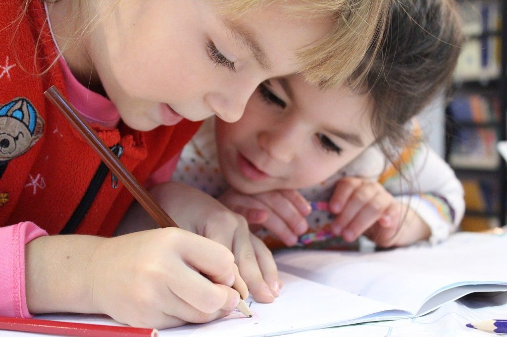 Children working together on a project. https://www.brandcontentstudios.com