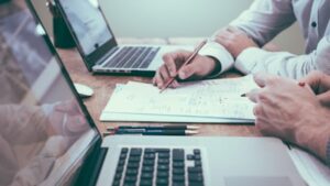 People working on content strategy and content marketing together on laptops.