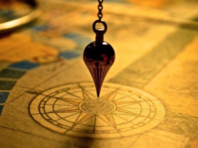 Weight over a compass illustrating executive thought leadership strategy